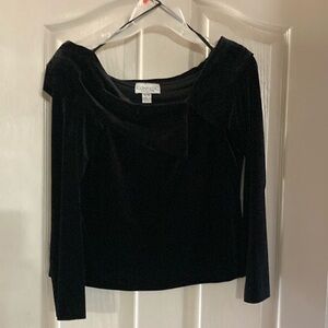 Black velvet waist length off shoulder top with lapel like accent